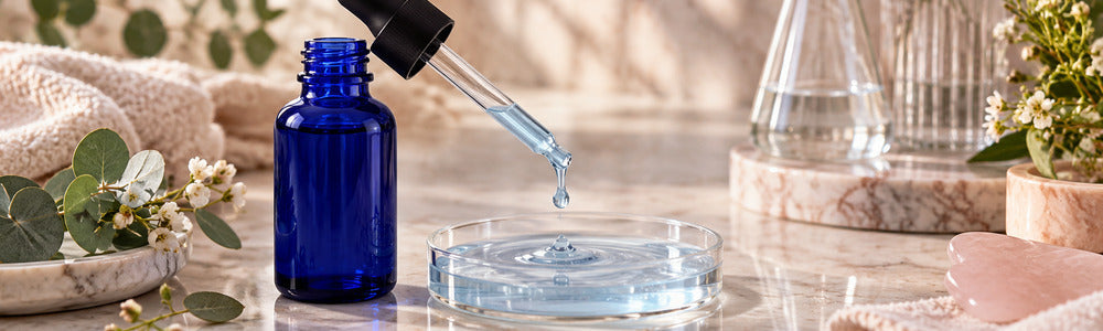 Unlabeled cobalt dropper and serum texture illustrating copper peptide pairing guidance