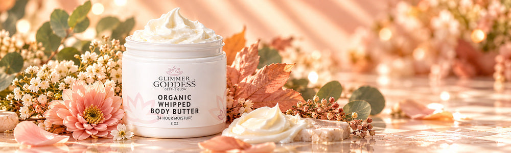 Glimmer Goddess Organic Whipped Body Butter in a luxurious autumn spa scene with blush flowers and golden leaves