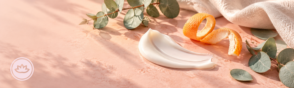 Glimmer Goddess brightening cream guide banner with a cream swatch, citrus peel, botanical leaves, and the lotus brand mark