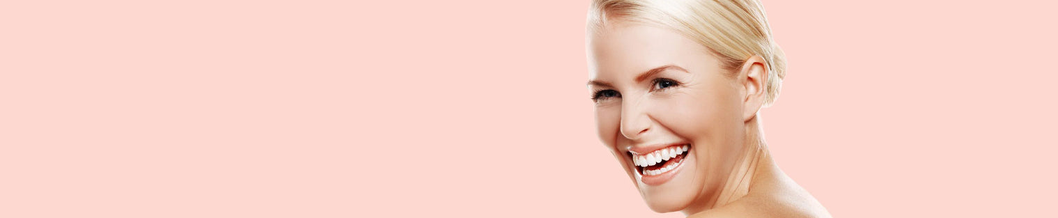 Woman smiling after using organic skin cream