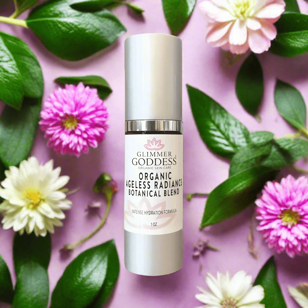Organic Skin Brightening Serum from Glimmer Goddess by pink and white flowers
