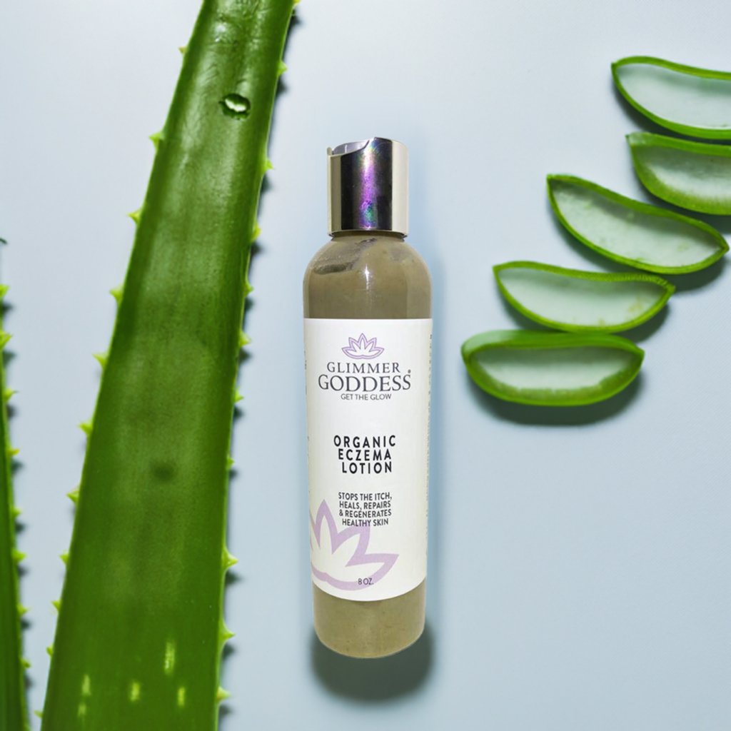 Close up of Aloe Vera next to Organic Eczema Lotion from Glimmer Goddess