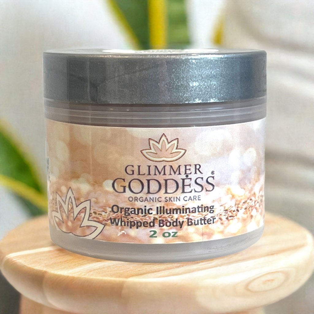 Organic shimmering body butter by Glimmer Goddess® in 2 oz travel size, showing a luxurious whipped texture with shimmer particles.