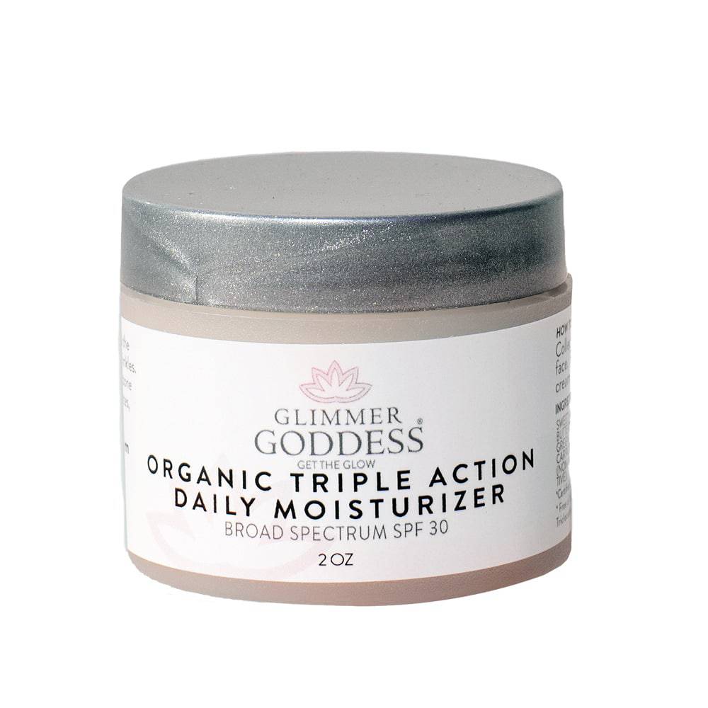 Organic Triple Action Daily Moisturizer with SPF 30 from Glimmer Goddess® Organic Skin Care, featuring a smooth cream texture.