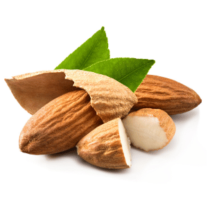 Whole and shelled almonds with green leaves on a white background