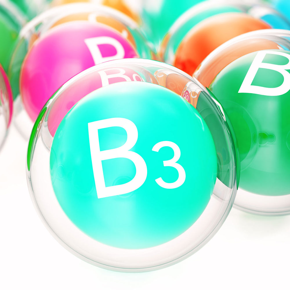Colorful vitamin B3 spheres representing key skincare ingredient