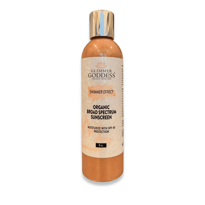 Glimmer Goddess Organic Skin Care Goddess Glow Shimmer Suntan Lotion SPF 40 with reef-safe formula and radiant shimmer finish.