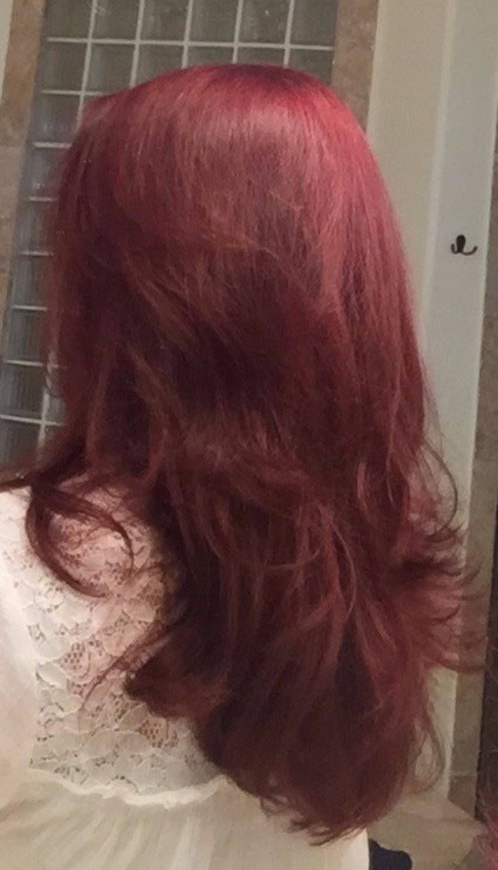 Woman's hair after using Organic Caffeine Shampoo for Hair Growth from Glimmer Goddess